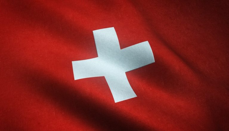 closeup-shot-waving-flag-switzerland-with-interesting-textures_181624-11129